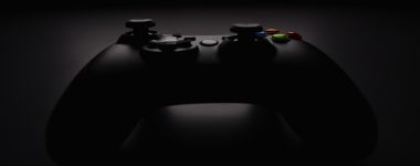 shallow focus photography of black Xbox controller